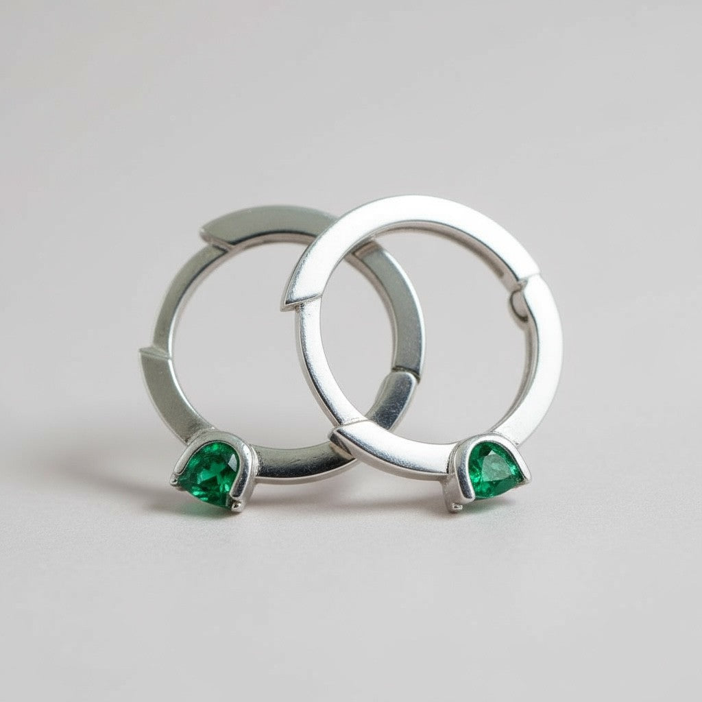 colombian-emerald-huggie-hoop-earrings-sterling-silver-lucigo-jewelry-flat two earrings