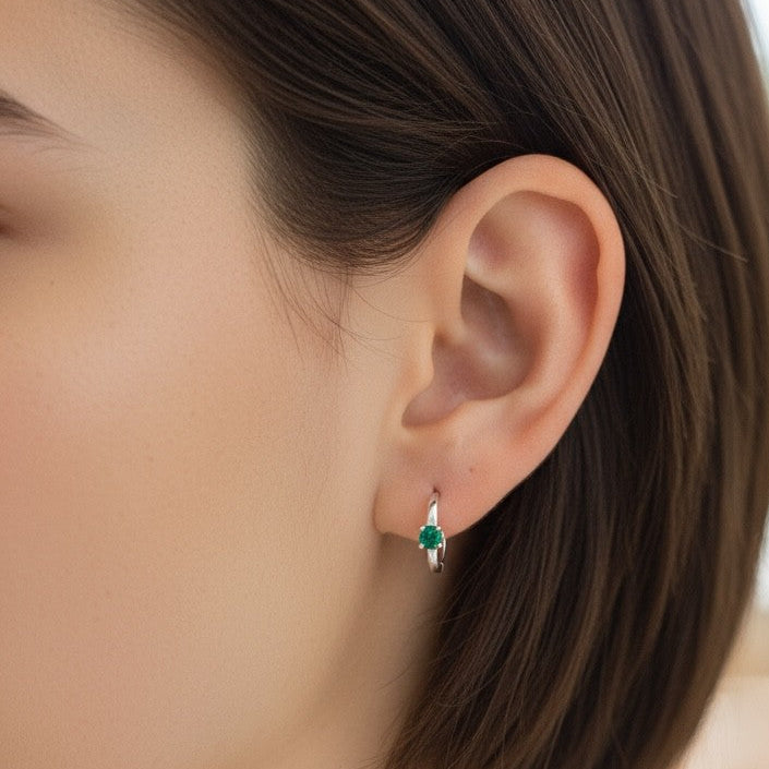 colombian emerald huggie hoop earrings sterling silver lucigo jewelry on woman